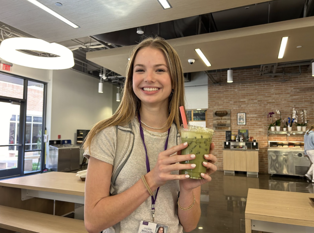 9th grader Drewsie Willson holding the new iced matcha latte in the DLC, “I love matcha because of its gritty texture and the at-first sweet sip turning into a bitter aftertaste,” Wilson said. 
